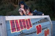 Nonbinary-traveler-LGBTQ-Alaska-laying-on-truck